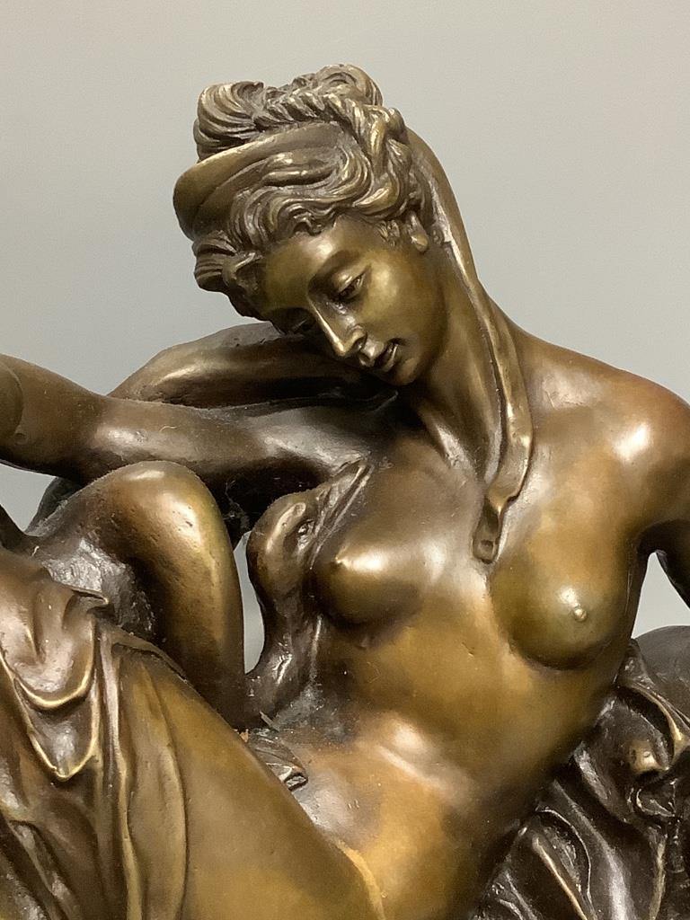 A cold cast resin bronze of Leda and the swan, on marble base, length 48cm